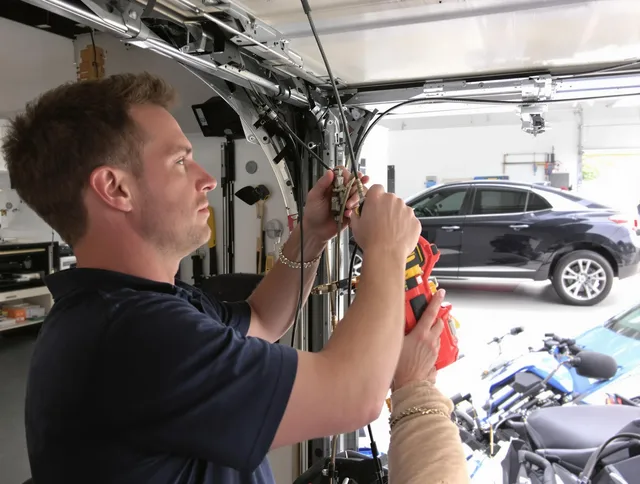 Somerset Garage Door Repair safety certified technician performing cable replacement in Somerset